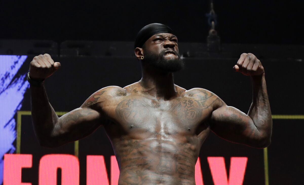 Deontay Wilder stands on the scale during a weigh-in at the MGM Grand Garden Arena in Las Vegas on Friday.