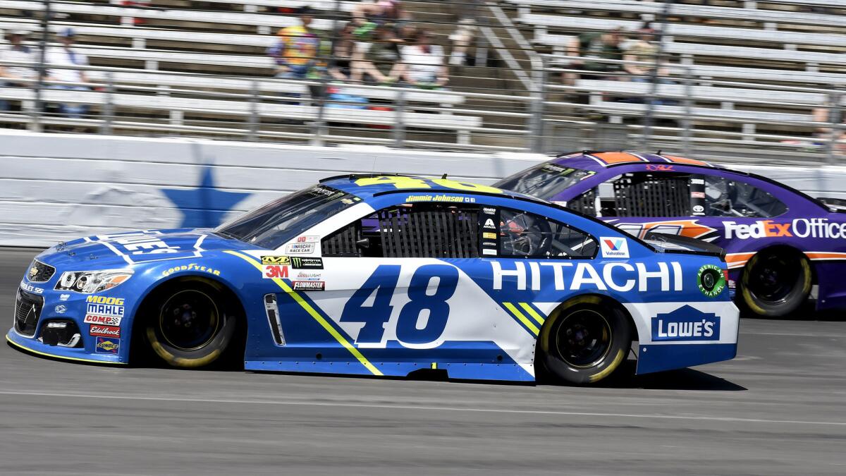 NASCAR driver Jimmie Johnson, in the No. 48 Chevy, comes out of Turn 4 at Texas Motor Speedway ahead of Denny Hamlin during the NASCAR Cup Series race Sunday.