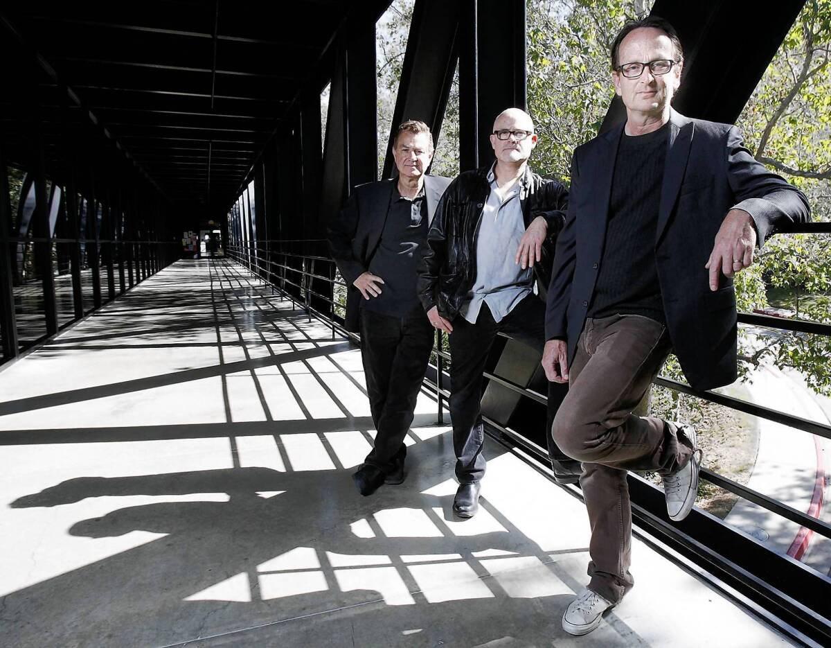 Mark Arbeit, left, George Holz and Just Loomis are pictured at the Art Center College of Design in Pasadena, where their exhibition, “Three Boys From Pasadena: A Tribute to Helmut Newton,” is on display