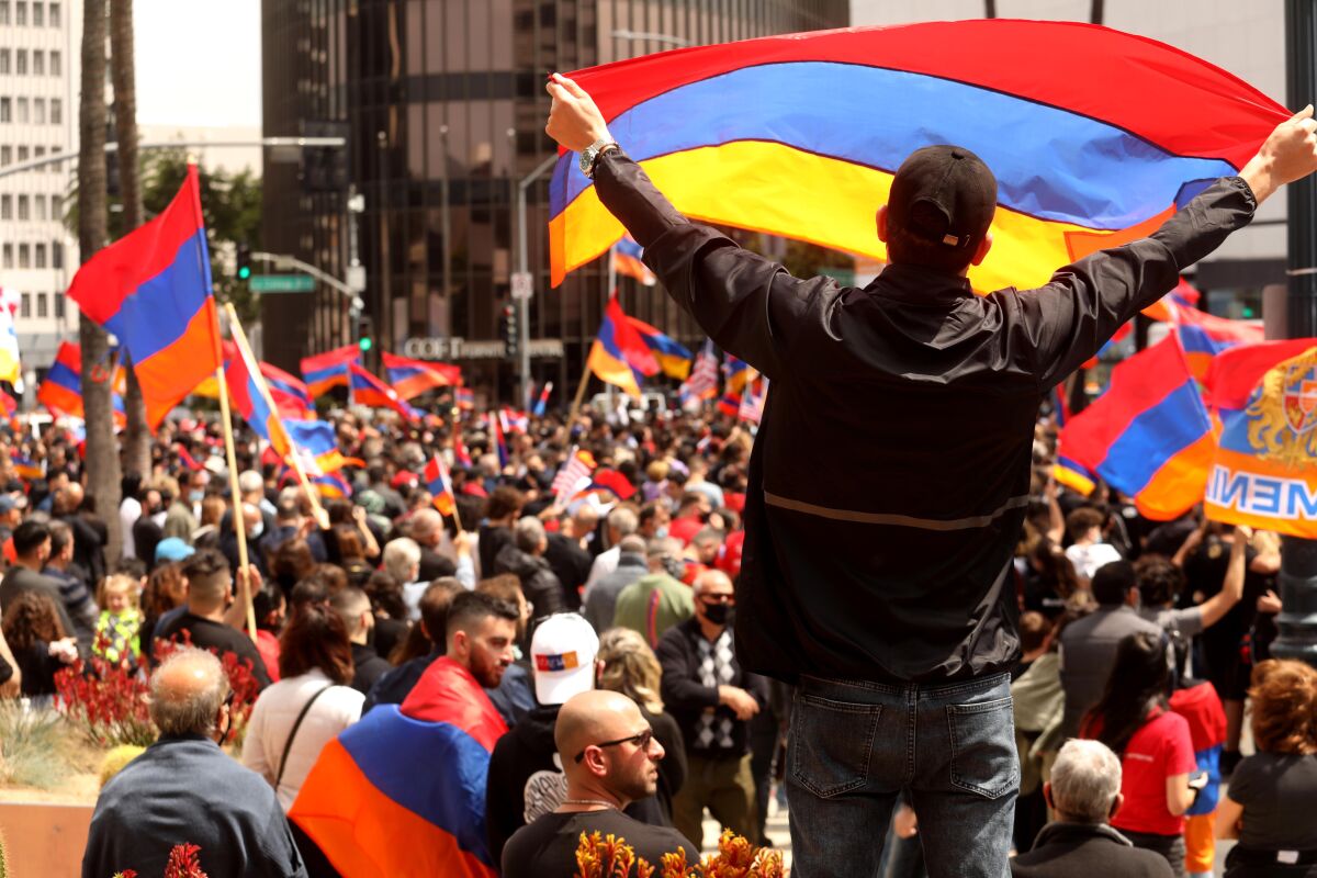 Garegin Antonyan waves the Armenian flag in front of the Turkish Consulate in Beverly Hills.