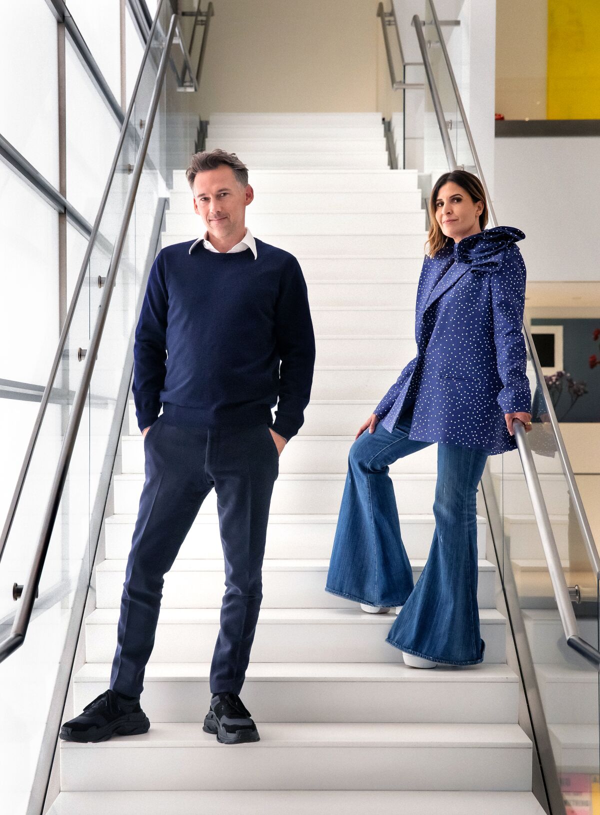 Joel Lubin and Maha Dakhil pose on a stairwell