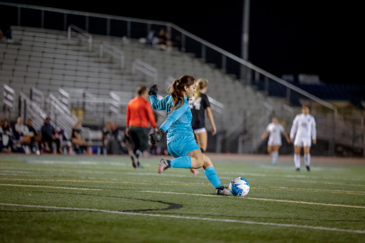 Eva Hernandez-Watsek clears the ball.