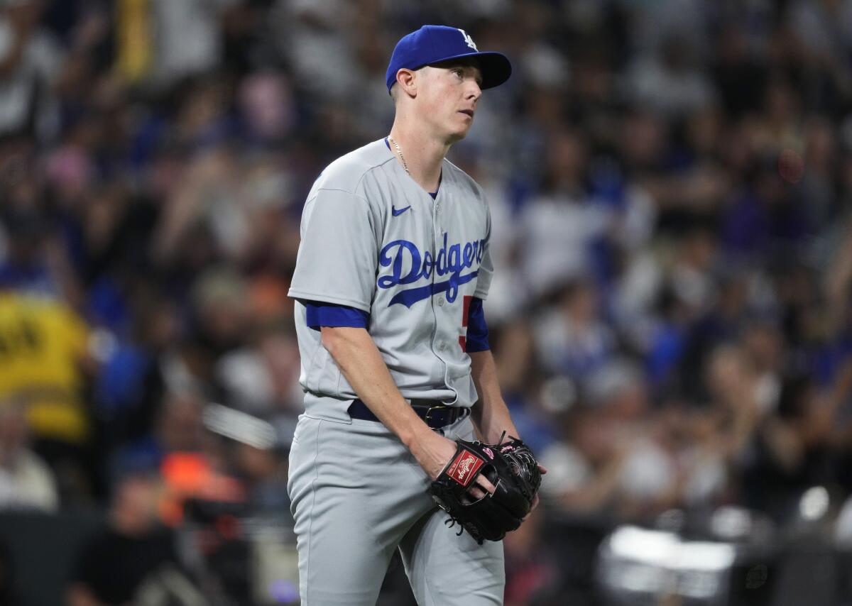 Dodgers pitcher Ryan Yarbrough reacts after giving up a two-run home run against Colorado's Elehuris Montero.