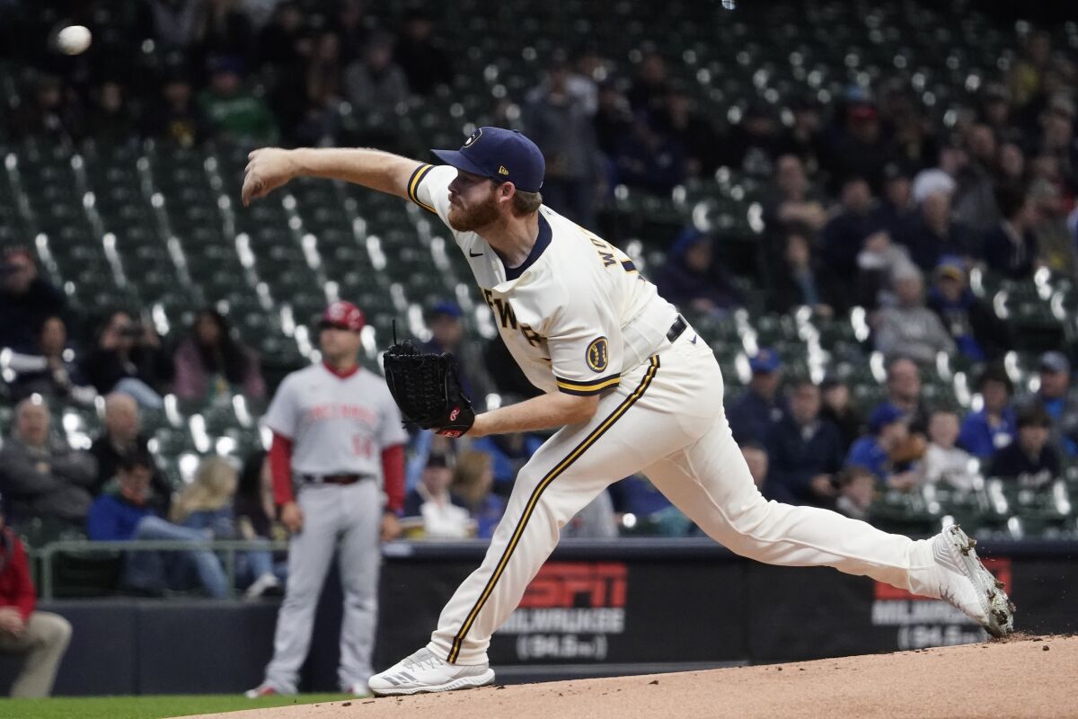 Milwaukee Brewers starting pitcher Brandon Woodruff throws during the first inning of a baseball game against the Cincinnati Reds Tuesday, May 3, 2022, in Milwaukee. (AP Photo/Morry Gash)