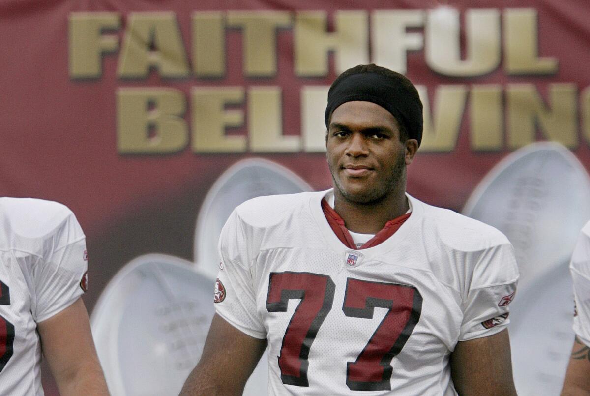 This Aug. 2, 2005, file photo shows former San Francisco 49ers tackle Kwame Harris as he walks onto the 49ers practice facility in Santa Clara.