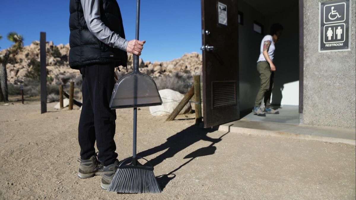 Volunteers prepare to clean a restroom at Joshua Tree National Park on Jan. 4. Campgrounds and some roads have been closed over safety concerns caused by the partial shutdown of the federal government.