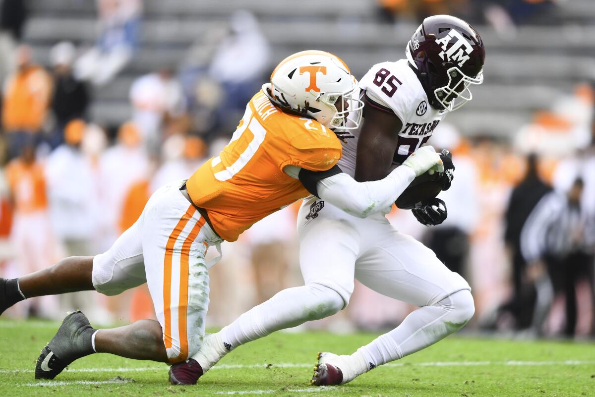 Tennessee linebacker Quavaris Crouch tackles Texas A&M tight end Jalen Wydermyer.