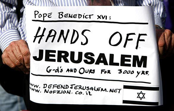 An Israeli activist also has a message for Pope Benedict XVI during a demonstration in central Jerusalem. Benedict was in Israel on the latest leg of a Holy Land pilgrimage that began in Jordan and will also take the pontiff to the occupied West Bank.