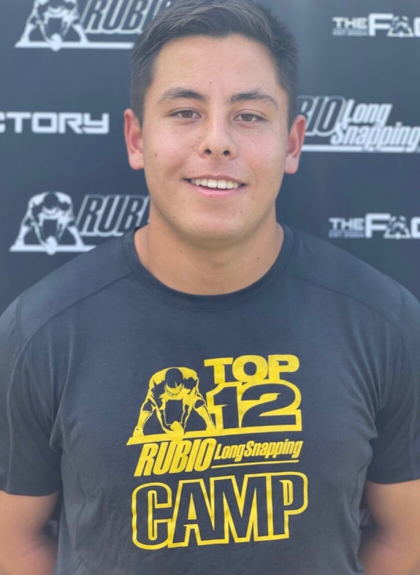 Kurt Chesney wears a T-shirt from Chris Rubio's long-snapping camp.