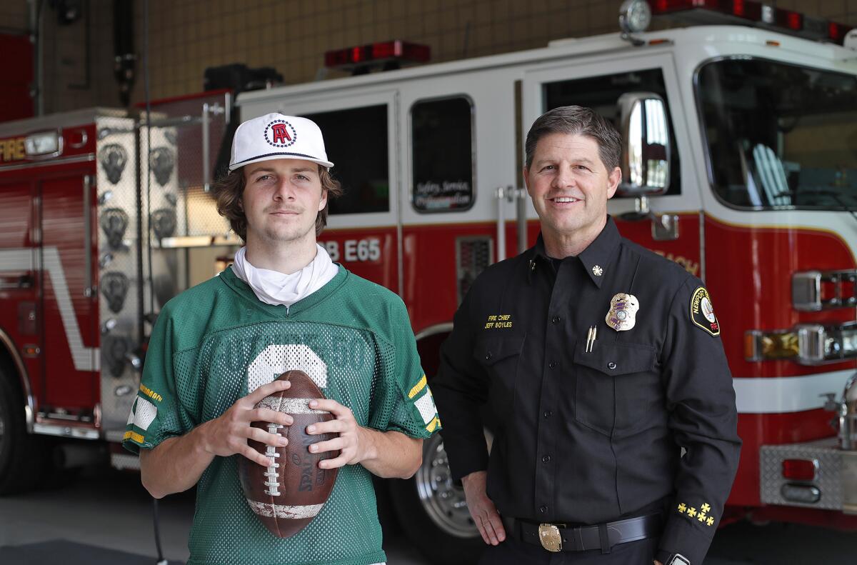 Edison's Braeden Boyles, stands with his dad, Newport Beach Fire Chief Jeff Boyles, at the Corona del Mar station Tuesday.