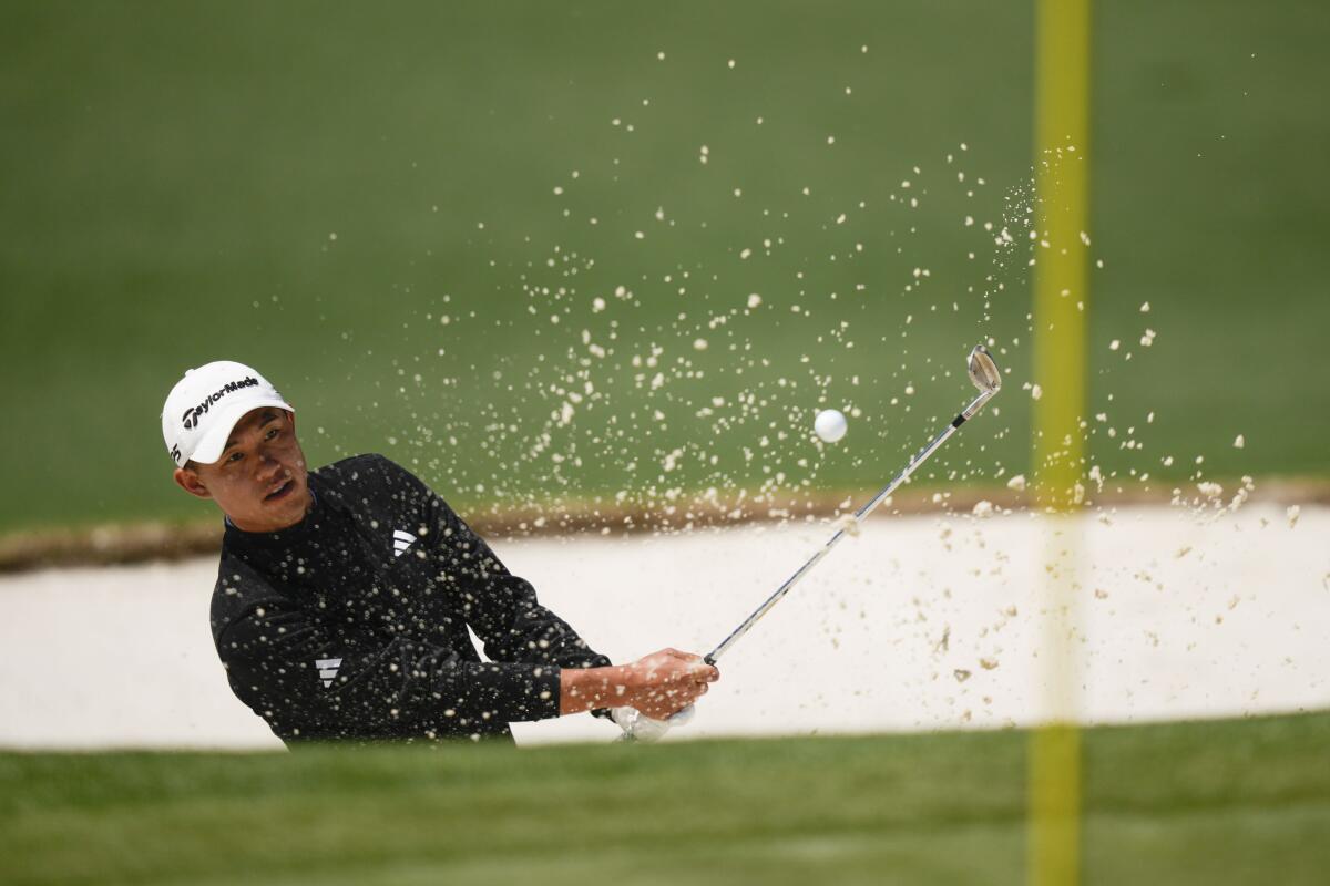 Collin Morikawa hits from the bunker on the second hole during the final round of the Masters on April 9.