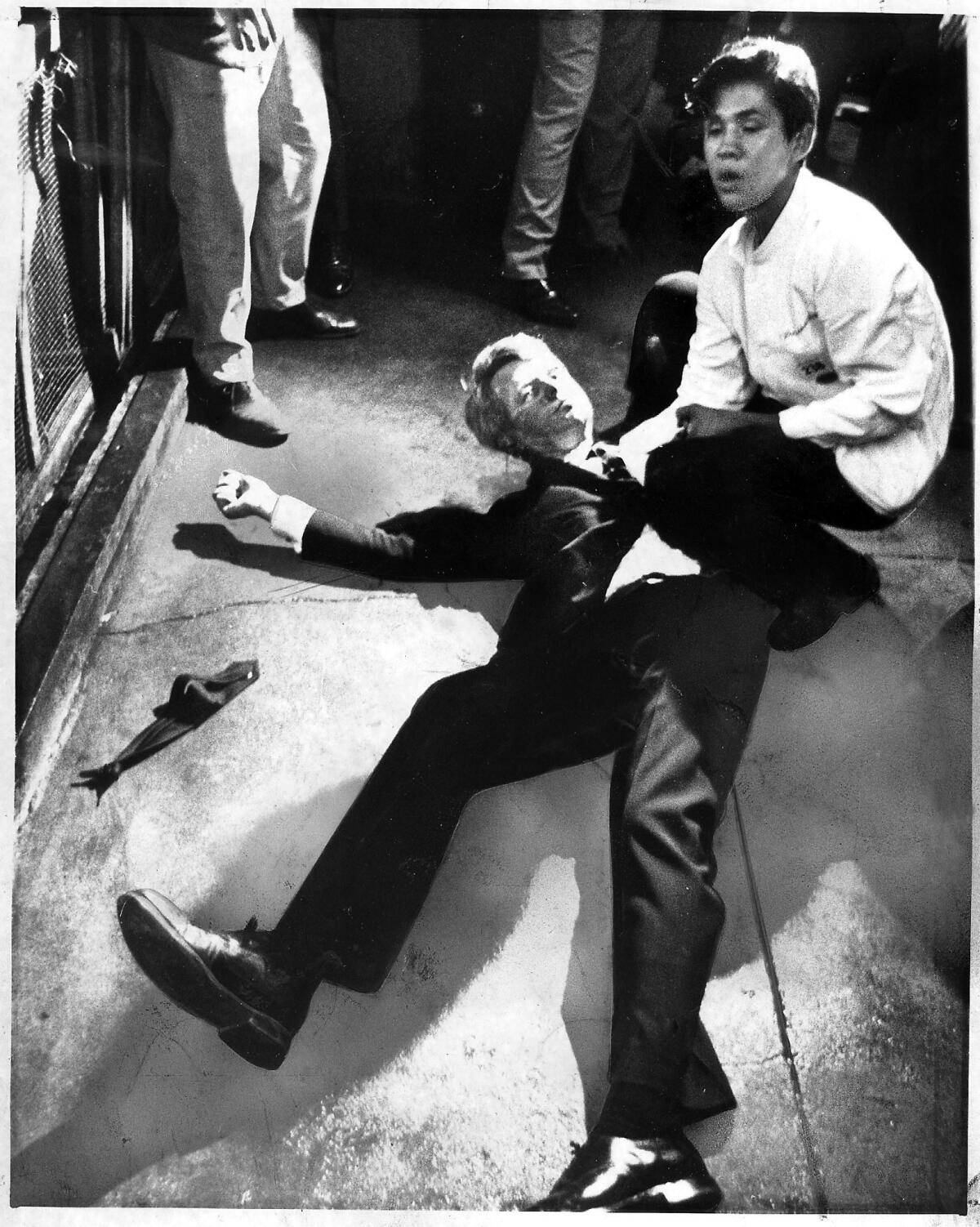 Presidential candidate Robert F. Kennedy lies on the floor at the Ambassador Hotel in Los Angeles moments after he was shot in the head. He had just finished his victory speech upon winning the California primary.