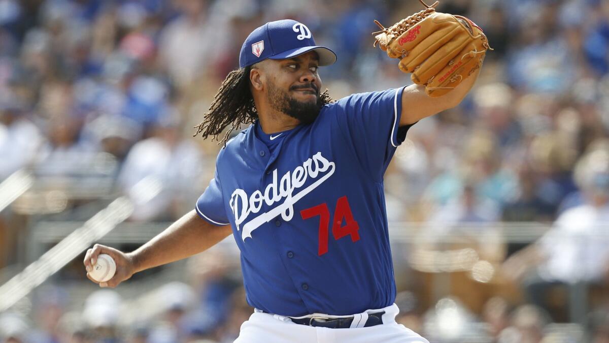 Dodgers pitcher Kenley Jansen pitches during a spring training game in Phoenix.