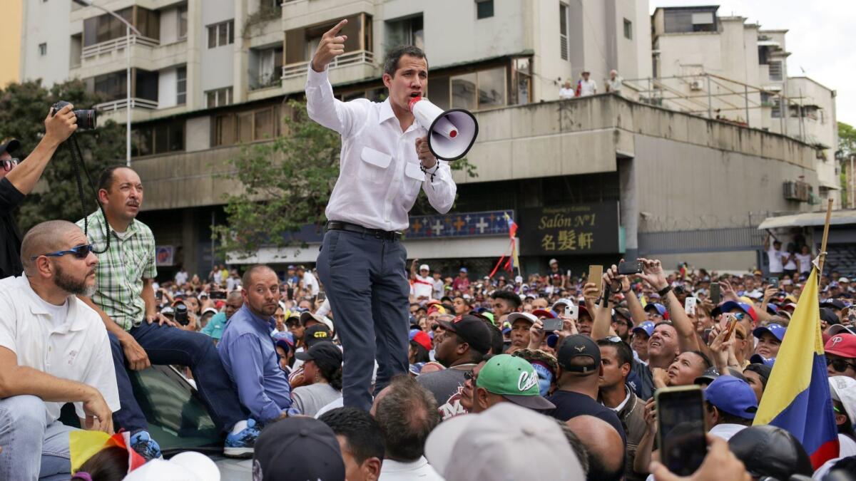 Venezuelan opposition leader and self-proclaimed acting President Juan Guaido speaks during a demonstration in Caracas on March 9, 2019.