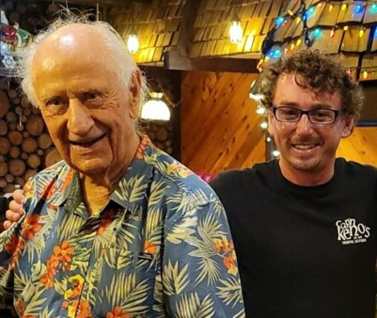 Longtime La Jolla surfer Jack "Woody" Ekstrom, 93 (left), meets Colin Friedkin at Captain Keno's restaurant in Encinitas.