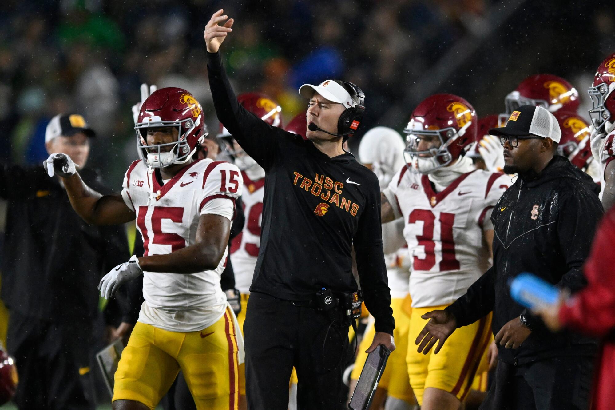 USC coach Lincoln Riley signals to his players from the sideline during a loss at Notre Dame on Oct. 18.