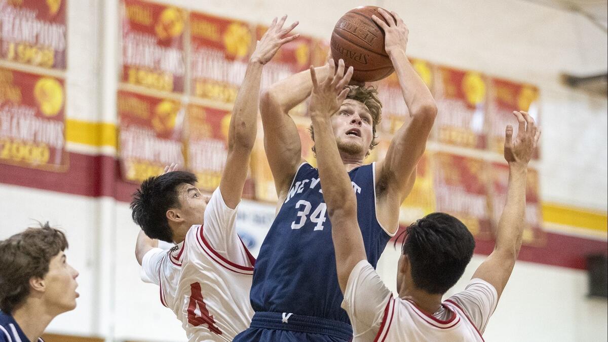Newport Harbor High's Dayne Chalmers, pictured going up for a shot at Loara on Nov. 27, helped the Sailors edge El Toro 61-58 in the semifinals of the Century Elks Classic on Friday.