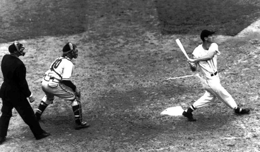 Ted Williams sends an "eephus" pitch from Pittsburgh's Rip Sewell into the right field bleachers for a three-run homer in the 1946 All-Star Game at Fenway Park.