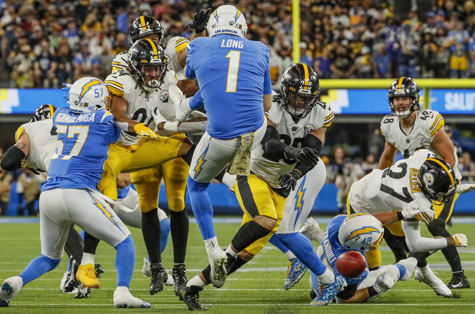 Pittsburgh Steelers safety Miles Killebrew blocks the punt by the Chargers' Ty Long during the second half.