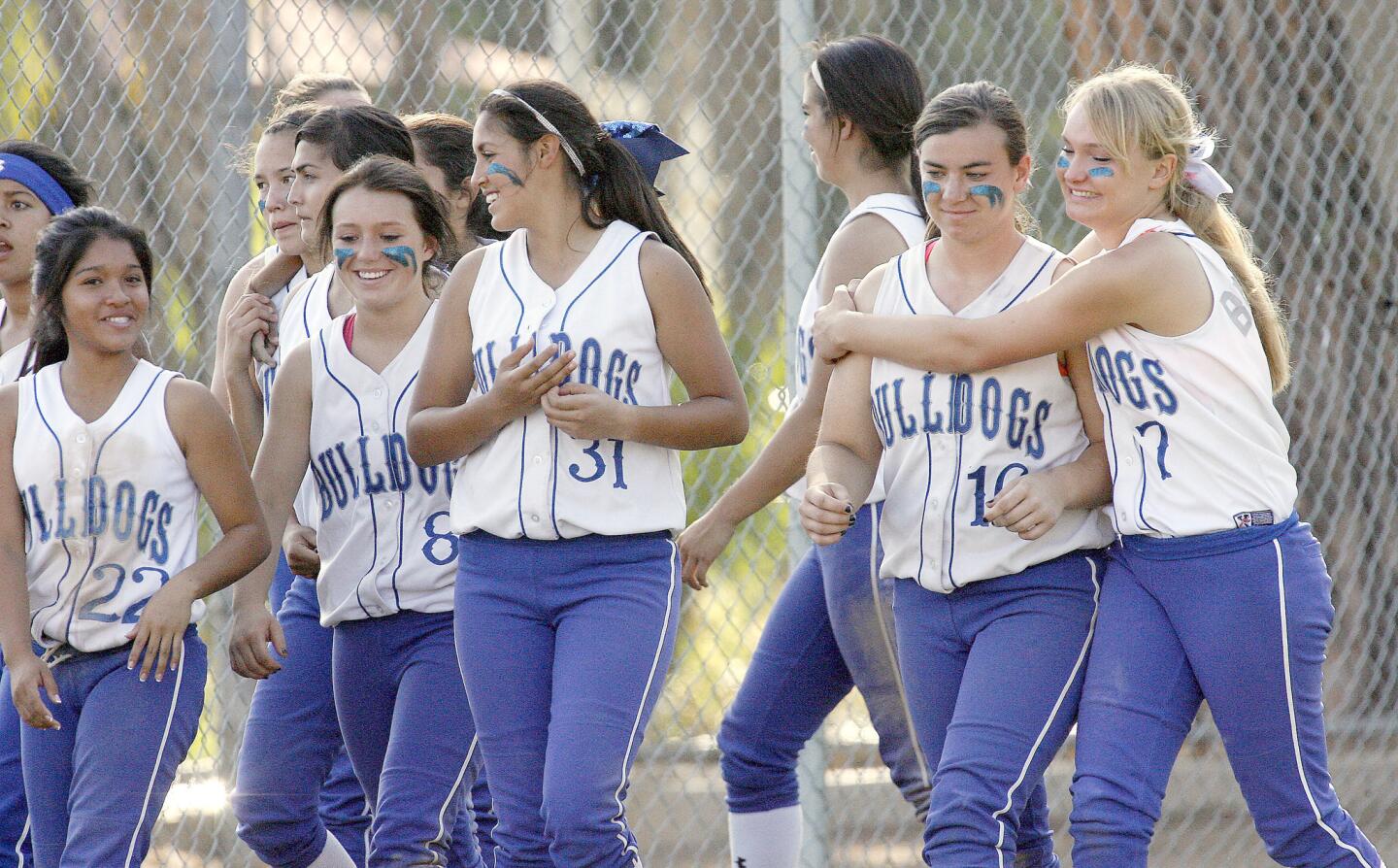 The Burbank High girls softball team leaves the field after losing a CIF second-round playoff game to Sunny Hills on Tuesday, May 21, 2013.
