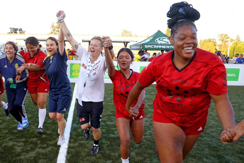 SACRAMENTO, CA - JULY 11: Women's Team USA head coach Lisa Wrightsman, center, along with players.