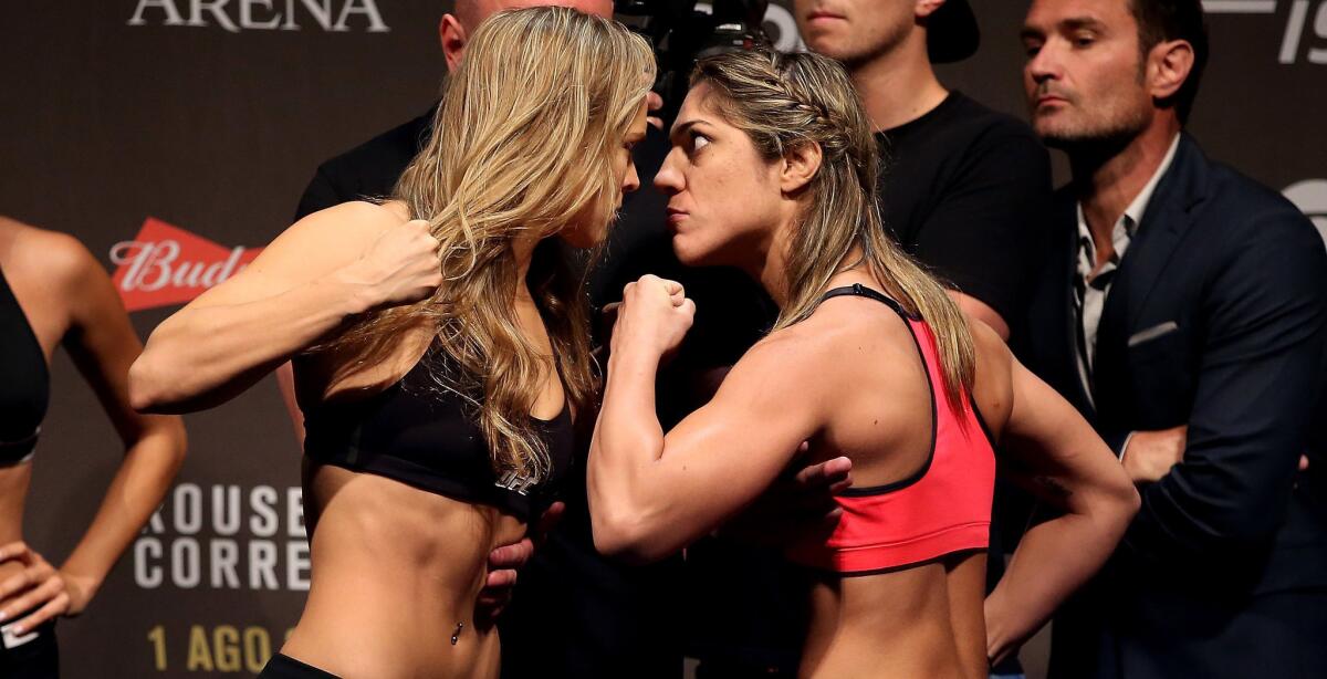 Ronda Rousey, left, and Bethe Correia face off during their UFC 190 weigh-in on Friday.