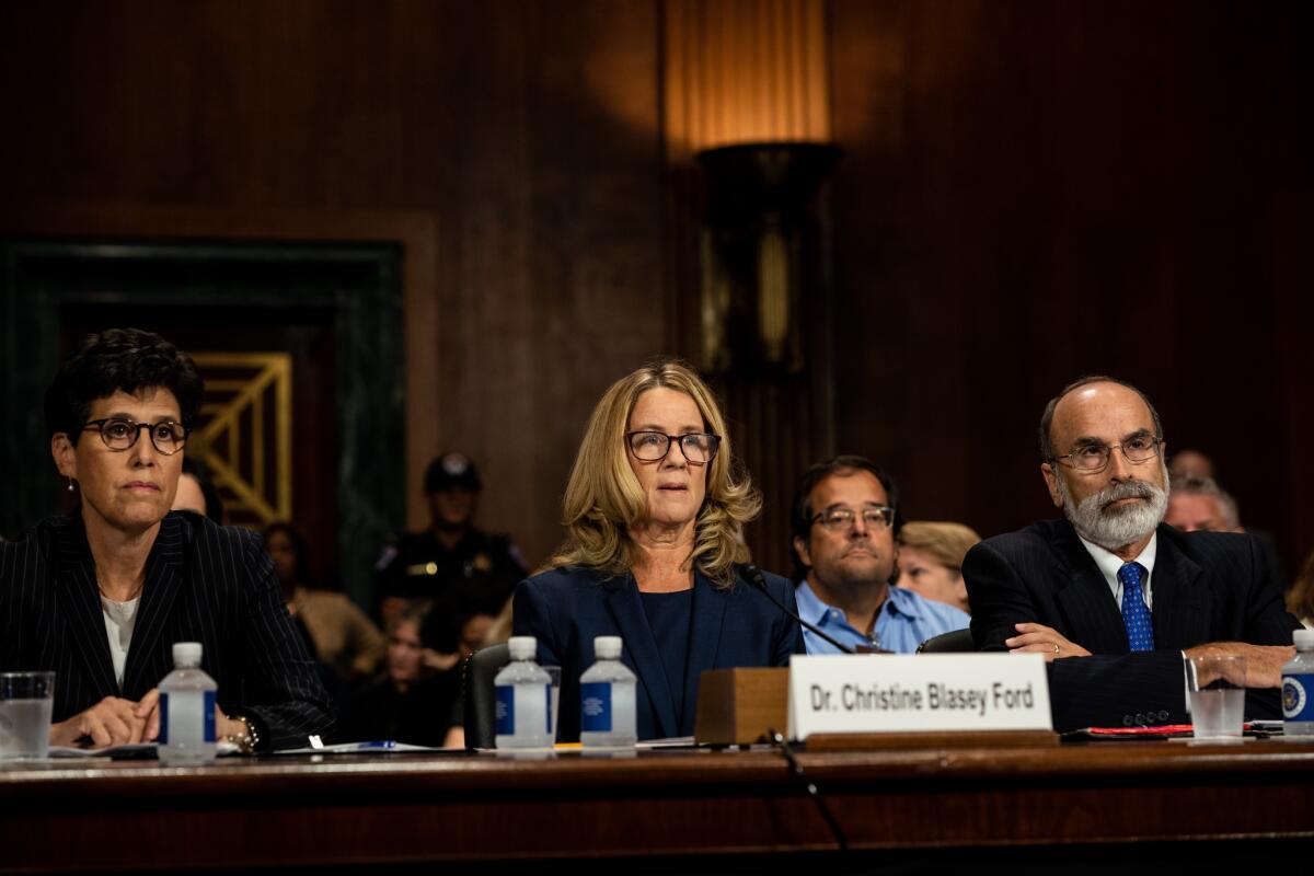 Christine Blasey Ford listens to opening statements prior to testifying before the Senate Judiciary Committee.