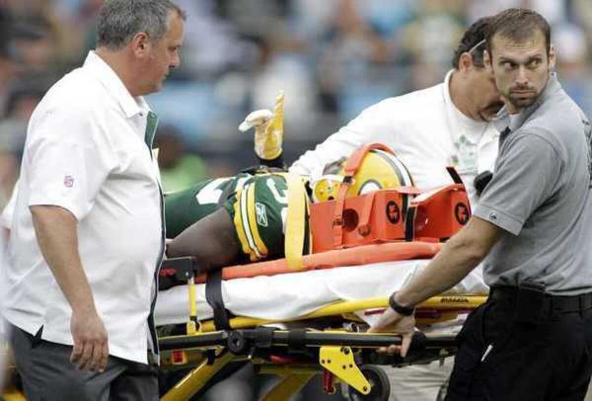 Green Bay Packers safety Nick Collins is taken off the field on a stretcher in a game against the Carolina Panthers on Sept. 18.