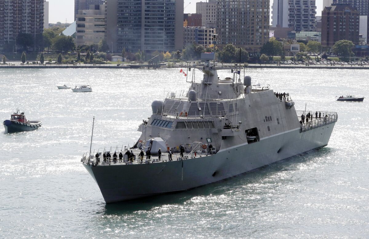 FILE - The USS Detroit, a Freedom-class of littoral combat ship, arrives Friday, Oct. 14, 2016, in Detroit. The Navy that once wanted smaller, speedy warships to chase down pirates has made a speedy pivot to Russia and China and many of those ships, like the USS Detroit, could be retired. The Navy wants to decommission nine ships in the Freedom-class, warships that cost about $4.5 billion to build. (AP Photo/Carlos Osorio, File)