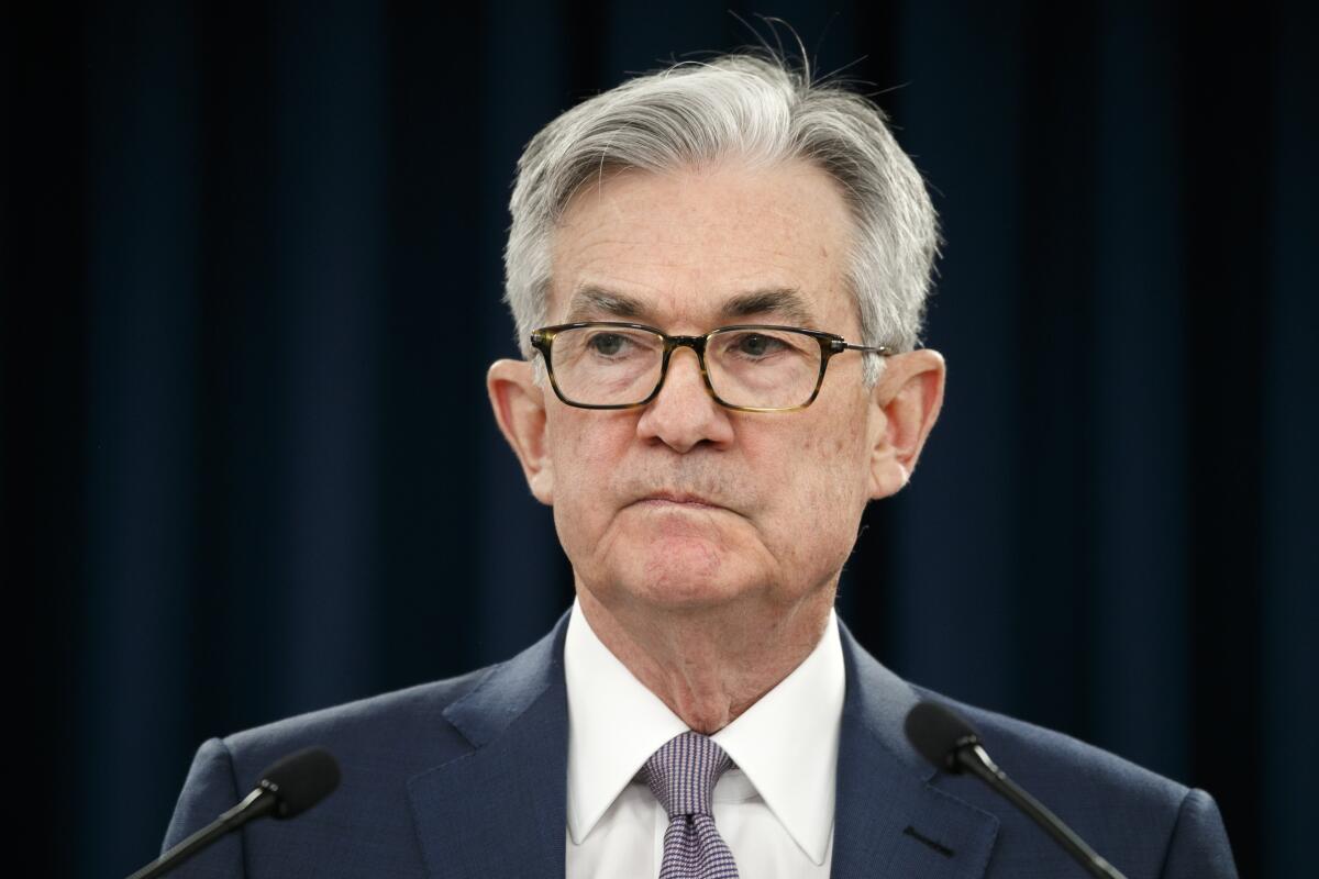 Federal Reserve Chair Jerome Powell pauses during a news conference, Tuesday, March 3, 2020, while discussing an announcement from the Federal Open Market Committee, in Washington.