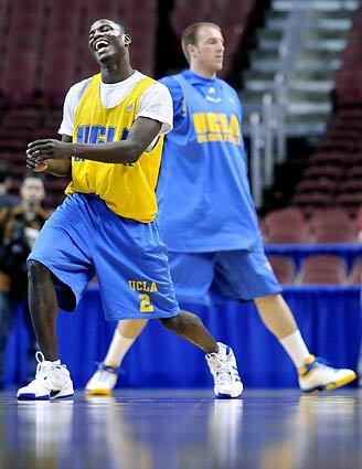 UCLA's Darren Collison, left, stretches during Wednesday's practice. The senior suffered a bruised tailbone two weeks ago but says he'll be ready for Thurday's game against VCU.