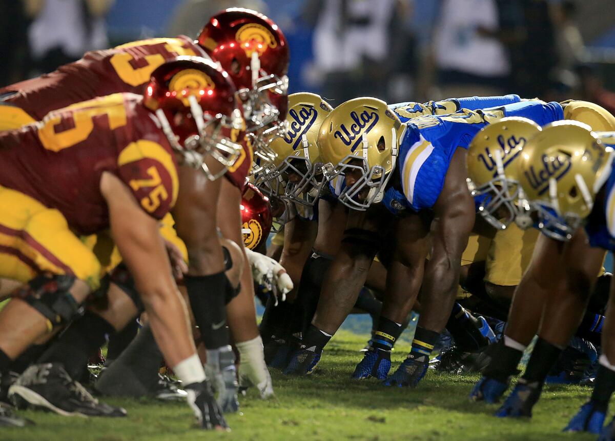 The Trojans' offensive line goes head to head with the Bruins' defensive line during the second quarter of a game at the Rose Bowl on Nov. 22, 2014.