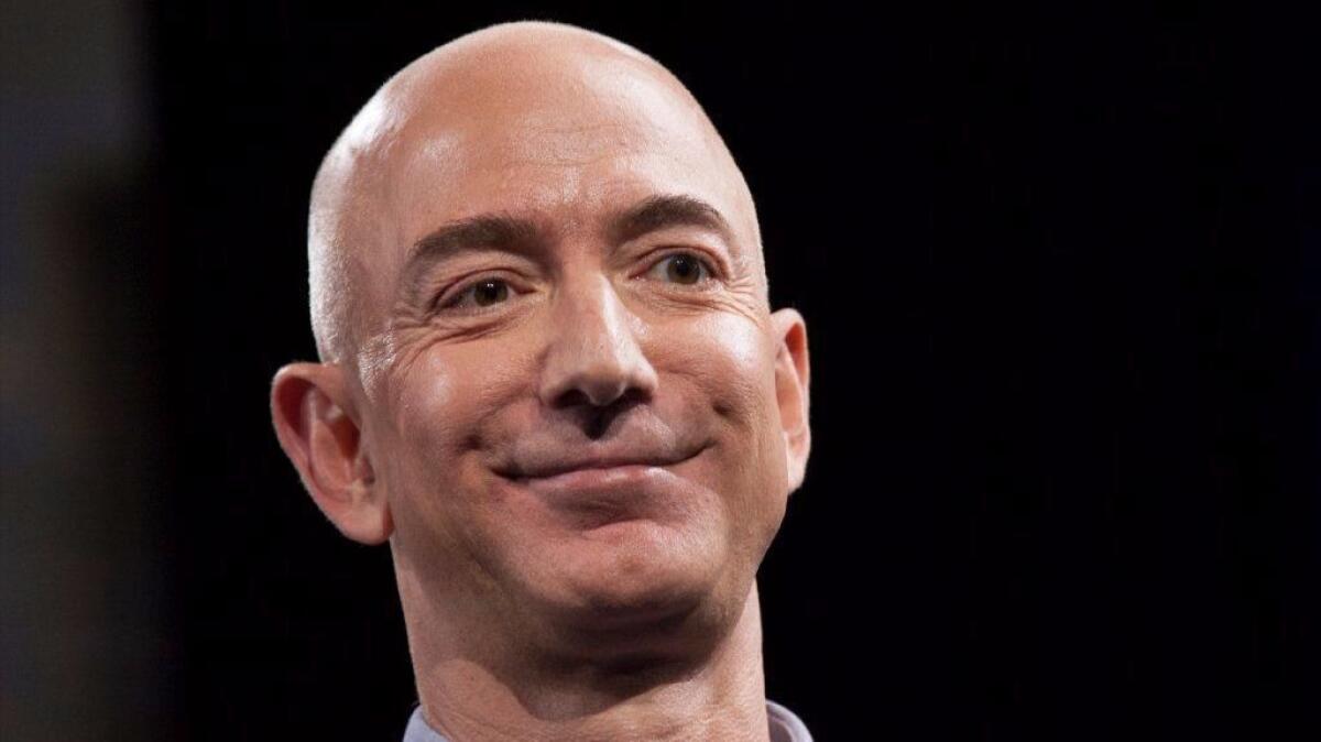 Amazon.com chief Jeff Bezos has paid $12.9 million for the house next door to his Beverly Hills estate.