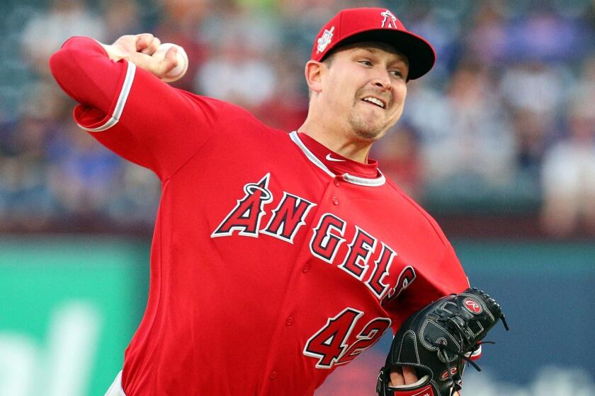 ARLINGTON, TEXAS - APRIL 15: Trevor Cahill #53 of the Los Angeles Angels delivers a pitch against the Texas Rangers in the first inning at Globe Life Park in Arlington on April 15, 2019 in Arlington, Texas. All players are wearing the number 42 in honor of Jackie Robinson Day. (Photo by Richard Rodriguez/Getty Images) ** OUTS - ELSENT, FPG, CM - OUTS * NM, PH, VA if sourced by CT, LA or MoD **