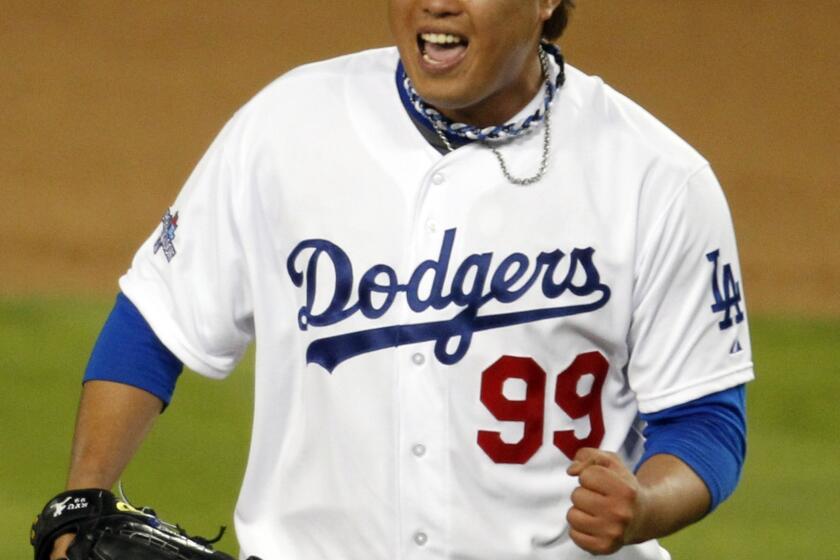 Dodgers starter Hyun-Jin Ryu celebrates his final strikeout during the seventh inning of the Dodgers' 3-0 victory over the St. Louis Cardinals in Game 3 of the National League Championship Series on Monday.