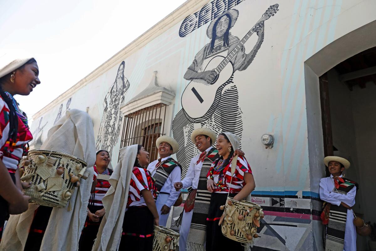 Members of Ballet Folklorico Son Mixteco wait to perform at the Casa de la Cultura in Tlaxiaco. Yalitza Aparicio, star of the movie "Roma," had her audition at the center.