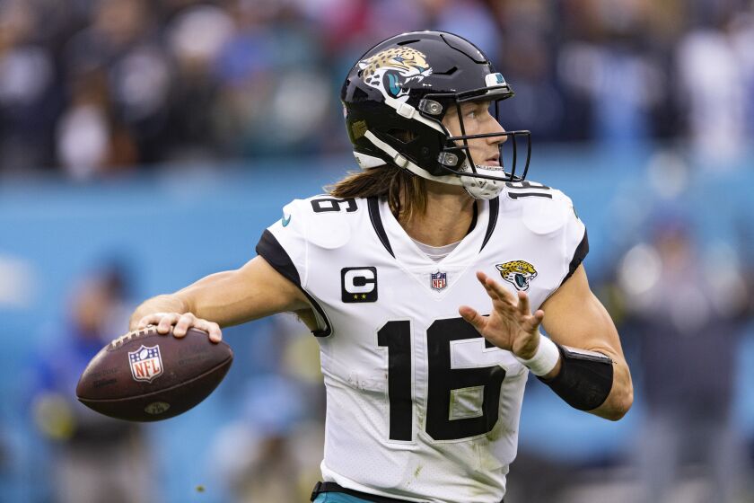 Jacksonville Jaguars quarterback Trevor Lawrence (16) throws to a receiver during their game against the Tennessee Titans, Sunday, Dec. 11, 2022, in Nashville, Tenn. (AP Photo/Wade Payne)