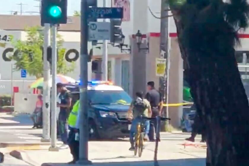 The aftermath of a fatal stabbing of a rider exiting a metro bus at the Slauson and Figueroa intersection on June 26, 2024.