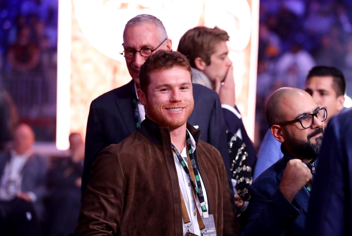 DIRIYAH, SAUDI ARABIA - DECEMBER 07: Canelo Alvarez is seen ringside prior to the of the WBC World Heavyweight Elimnator fight between Alexander Povetkin and Michael Hunter during the Matchroom Boxing 'Clash on the Dunes' show at the Diriyah Season on December 07, 2019 in Diriyah, Saudi Arabia (Photo by Richard Heathcote/Getty Images) ** OUTS - ELSENT, FPG, CM - OUTS * NM, PH, VA if sourced by CT, LA or MoD **