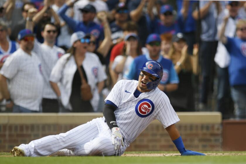 Chicago Cubs' Seiya Suzuki celebrates at home plate after scoring on an Yan Gomes double during the second inning of a baseball game against the Colorado Rockies Sunday, Sept. 24, 2023, in Chicago. (AP Photo/Paul Beaty)