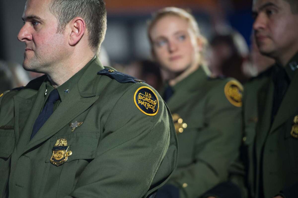 Members of the U.S. Border Patrol wait for President Donald Trump to speak to the staff of the Department of Homeland Security in Washington on Jan. 25, 2017.