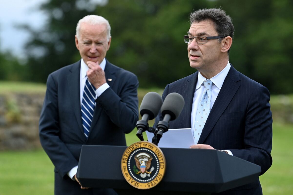 Pfizer CEO Albert Bourla gives a speech as President Biden looks on in Cornwall, England, ahead of the G-7 summit. 
