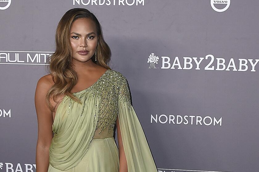 A woman in a glamorous green gown