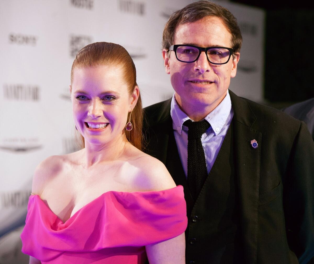 Amy Adams and David O. Russell arrive for the Vanity Fair Campaign Hollywood "American Hustle" toast sponsored by Chrysler.