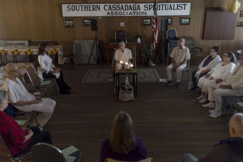 Dr. James Thomas, a spiritual reverend and chiropractor, leads a healing circle prayer service at the Cassadaga Spiritualist Camp on Thursday, January 17, 2019 in Cassadaga, Florida. The 57 acre camp is home to dozens psychics, mediums and spiritual healers who study and work in the small town.