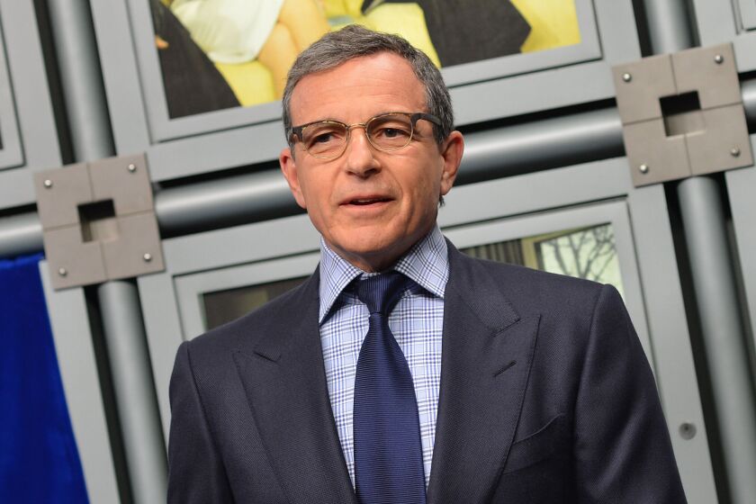 Bob Iger, seen in 2014, announced a "Star Wars" spinoff film's title and a sequel's release date at a Walt Disney Co. shareholders meeting.