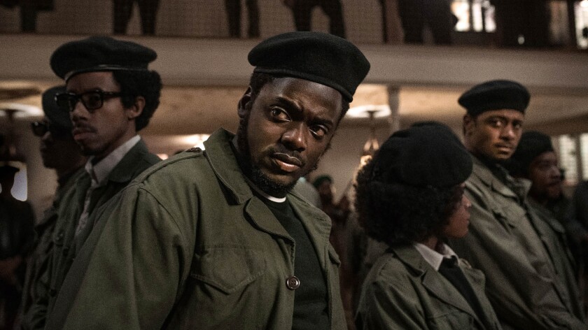 Daniel Kaluuya as Fred Hampton stands before Black Panther activists in uniform