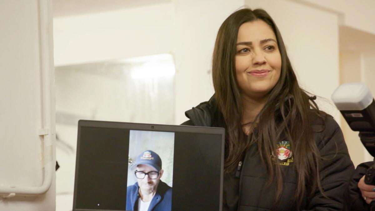 Gemma Owen, Wrexham's head of women's football, takes part in a virtual meeting with team co-owner Ryan Reynolds.