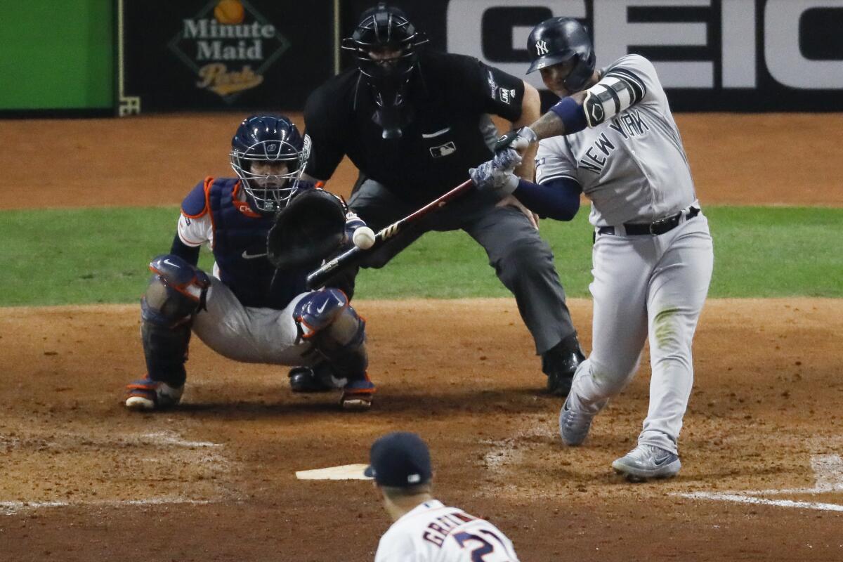 New York Yankees' Gleyber Torres hits a home run off Houston Astros starting pitcher Zack Greinke during the sixth inning in Game 1 of baseball's American League Championship Series Saturday, Oct. 12, 2019, in Houston. (AP Photo/Sue Ogrocki)