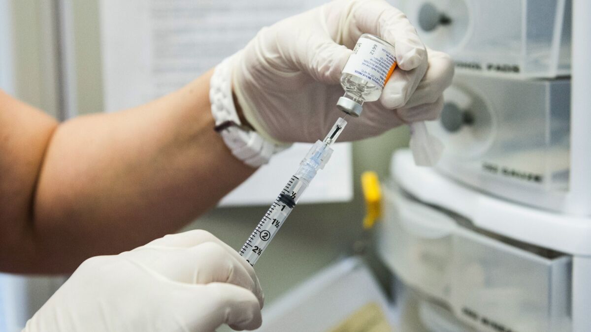 A dose of flu vaccine is drawn into a syringe. By developing a universal flu vaccine, scientists hope to eliminate the need to design a new shot every year.